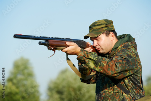 hunter with rifle gun