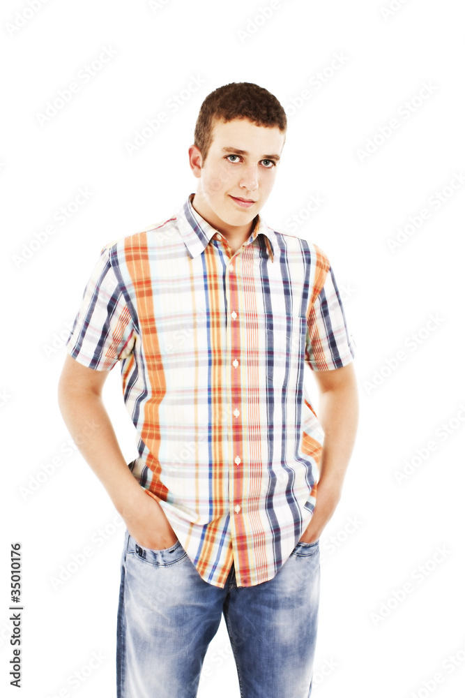 Young man standing with hands in pockets Young man standing with hands in pockets