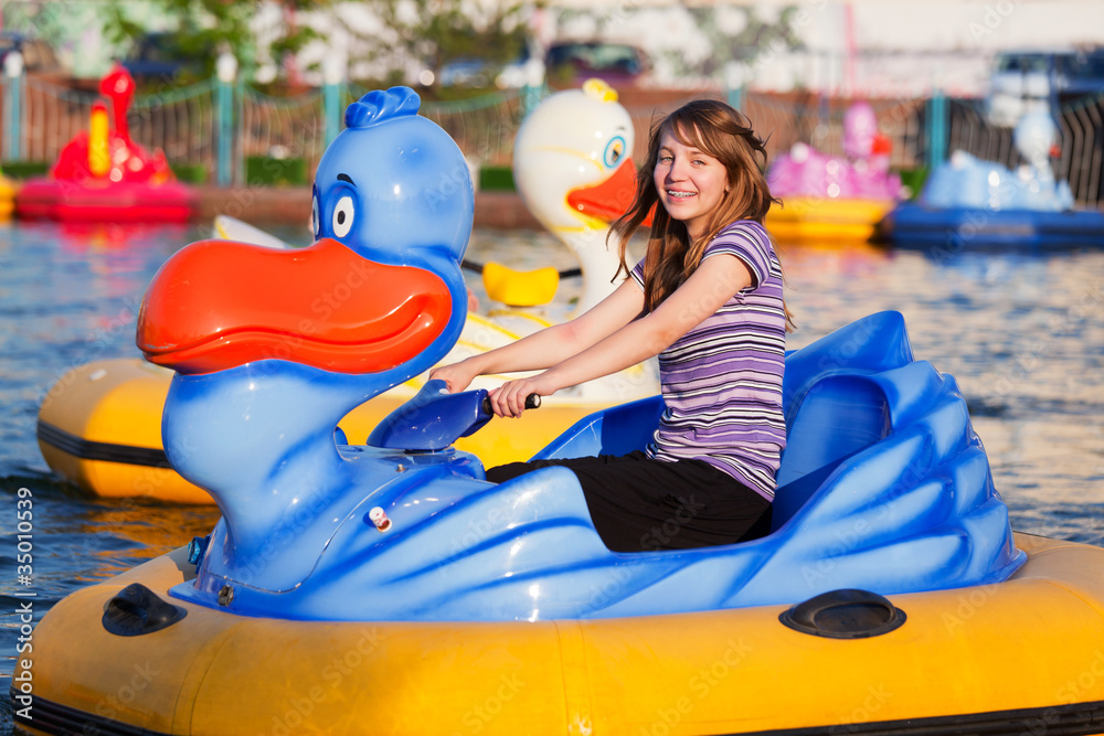 Fototapeta premium Teenage girl having fun in a water park