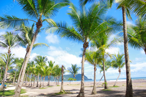 Beautiful tropical beach with palmtrees in Jaco, Costa Rica