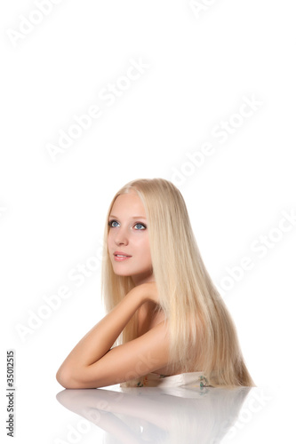 beautiful woman with magnificent long straight blond shiny hair