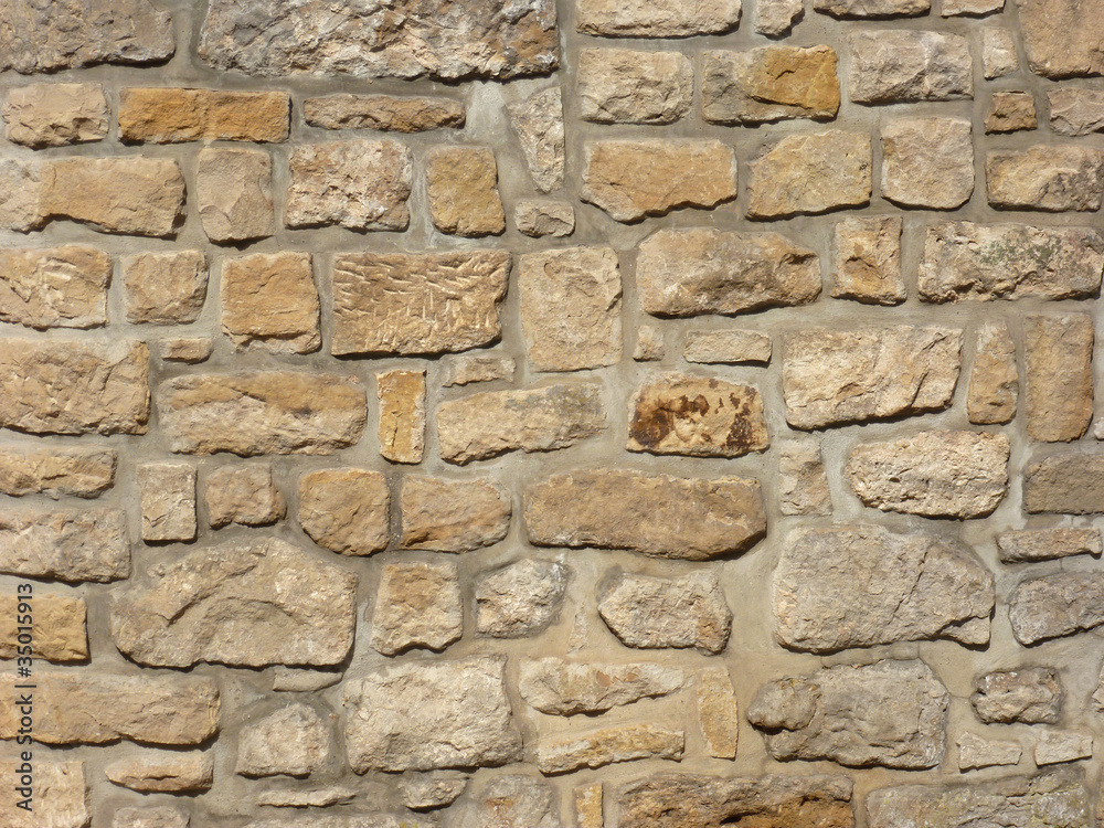 Gelbe Sandsteinmauer StockFoto Adobe Stock
