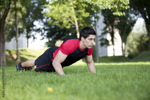 Athlete man making pushups