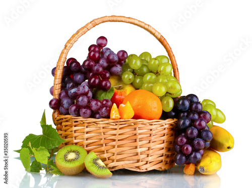Ripe juicy fruits in basket isolated on white
