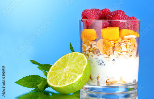 tasty cornflakes  fruit  milk in glass and mint