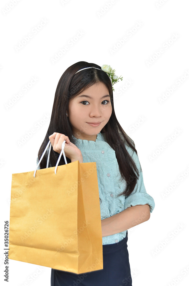 Asian woman smiling and holding shopping bag Asian woman smiling and holding shopping bag