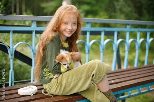 Young Smiling Girl with Puppy