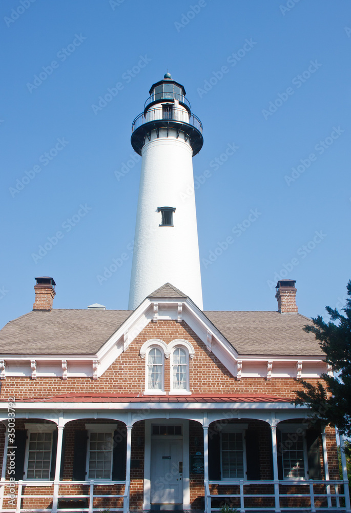 Traditional Brick Home and White Lighthouse