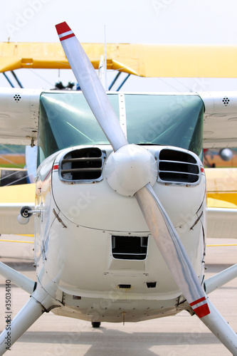 Front view of small jet and propeller