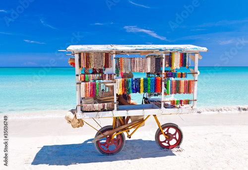 Cart selling typical souvenirs on cuban beach of Varadero photo