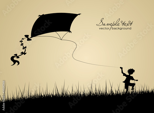 Little boy flying a kite