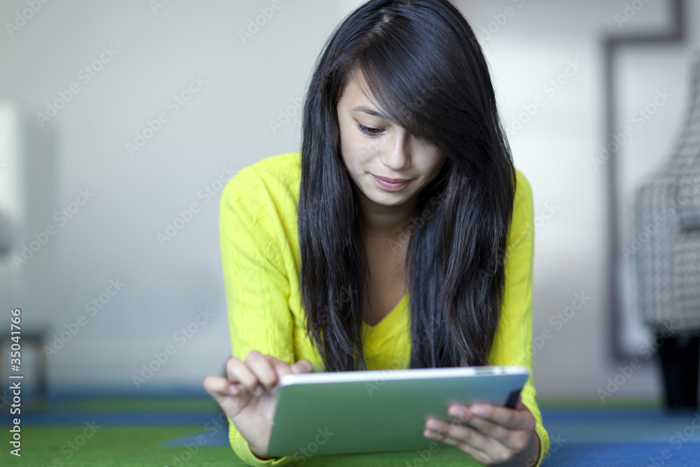 Asian girl using digital tablet Asian girl using digital tablet