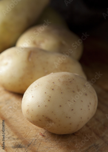 Potatoes on a chopping board