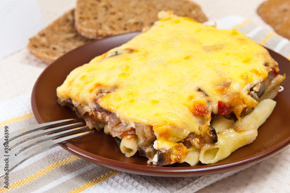 Pasta baked with eggplants, tomatoes and cheese