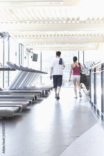 Couple walking together in health club