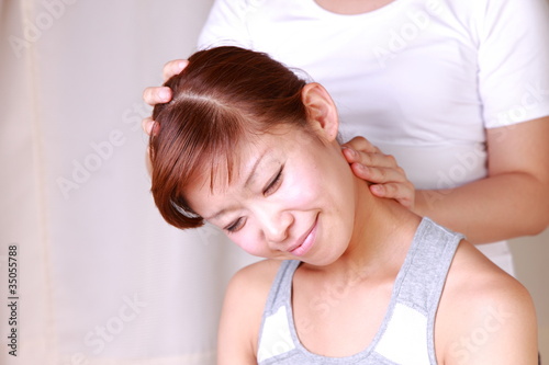 young japanese woman getting a massage