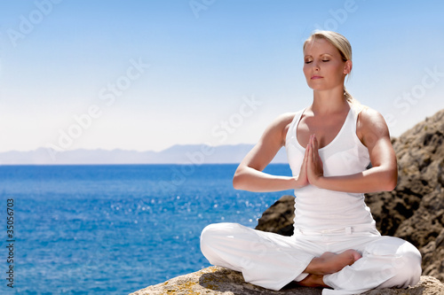 Beautiful girl meditating in yoga pose