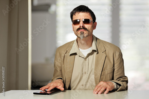 Obraz na plátně blind man with tablet pc