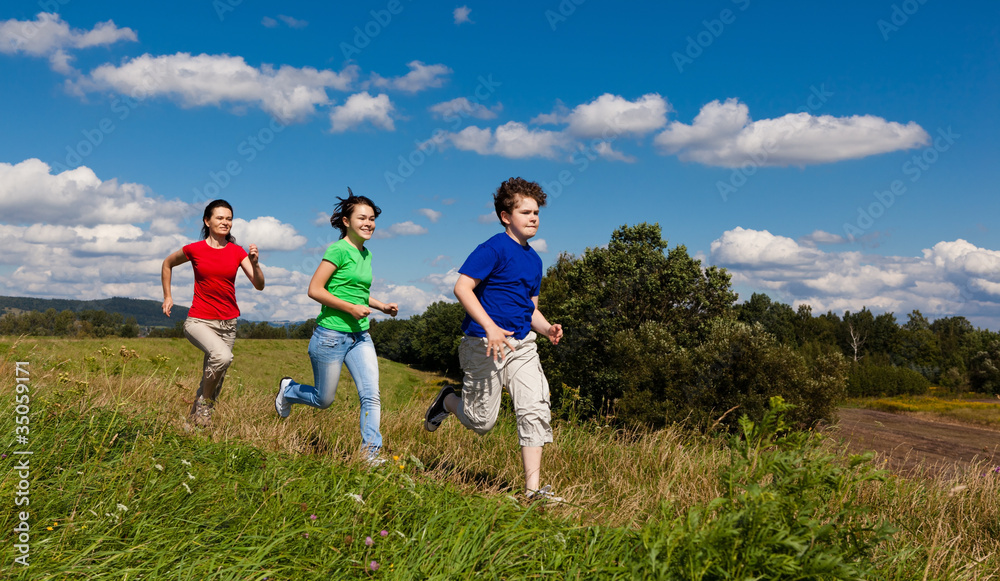 Active family - mother and kids running outdoor Active family - mother and kids running outdoor