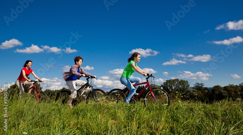 Family riding bikes