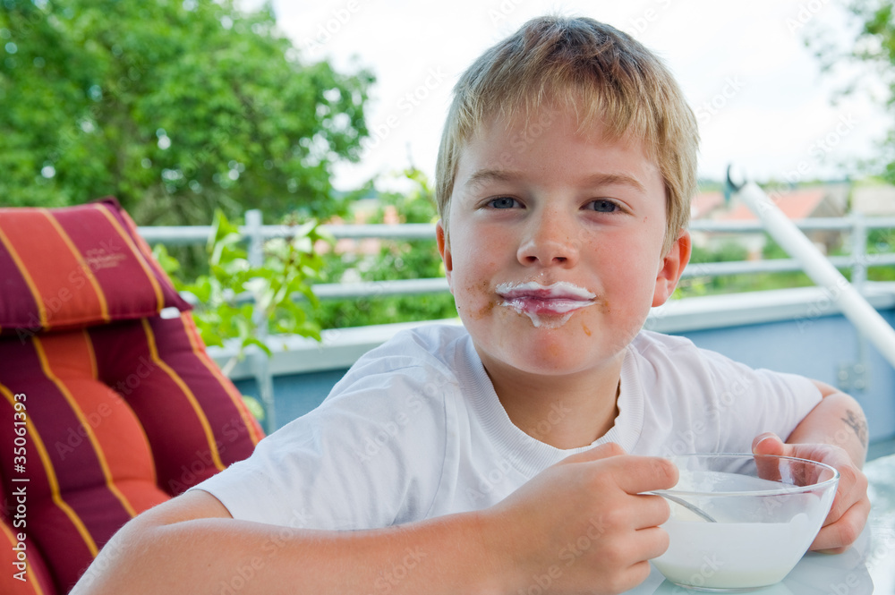 boy is eating granola Stock Photo Adobe Stock