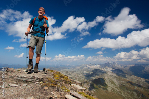 Young hiker enjoying mountain trekking