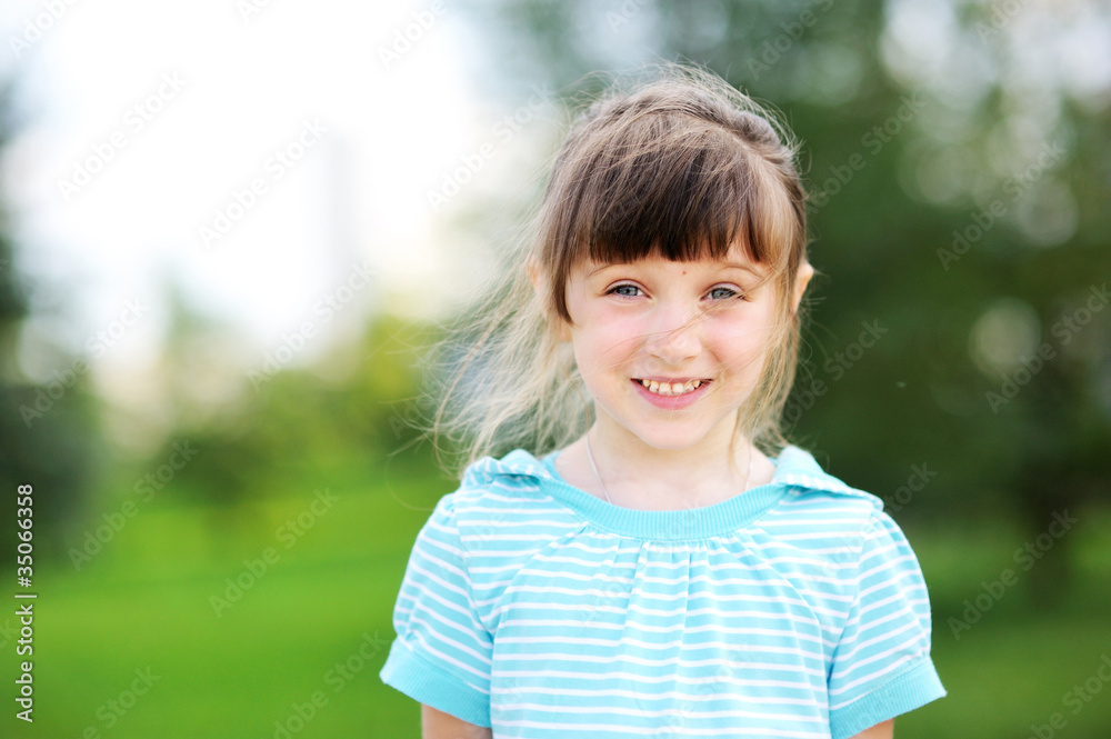 Outdoor portrait of cute child girl in blue jacket Outdoor portrait of cute child girl in blue jacket