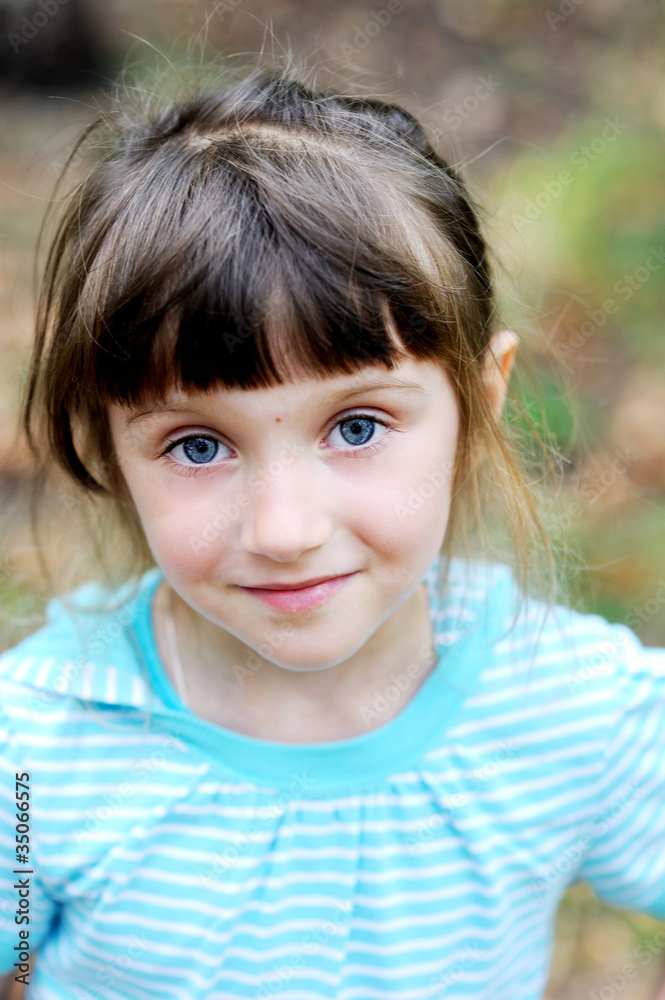 Outdoor portrait of cute child girl in blue jacket Outdoor portrait of cute child girl in blue jacket