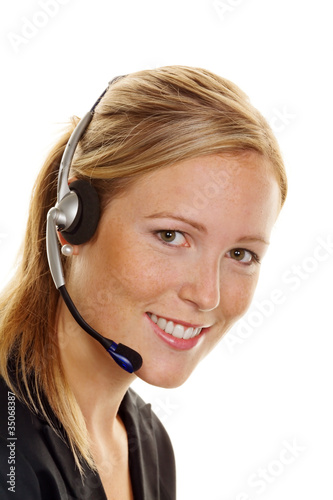 Frau mit Headset im Kundenservice photo