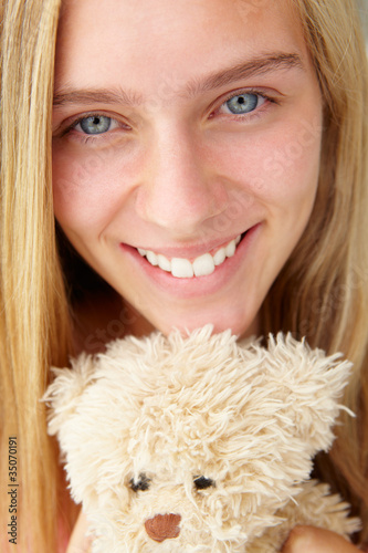 Close up teenage girl with cuddly toy photo
