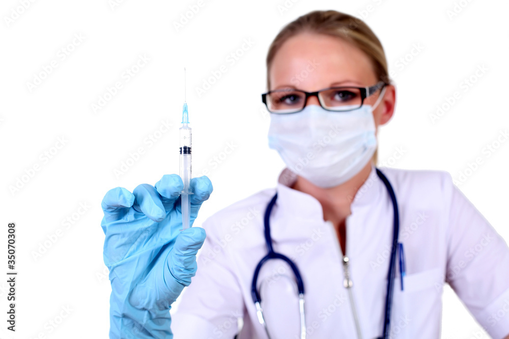 Young female doctor with syringe Young female doctor with syringe