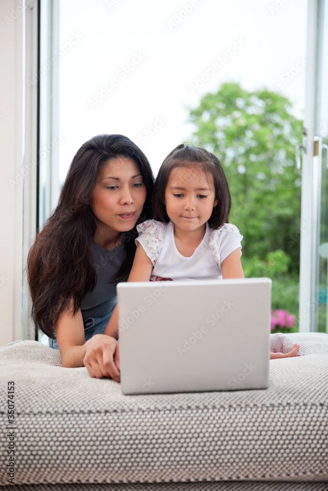 Mother and daughter with laptop Mother and daughter with laptop