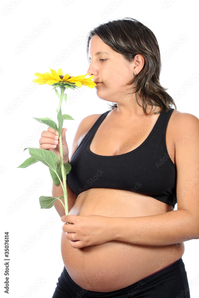 pregnant woman with beautiful belly and sunflower pregnant woman with beautiful belly and sunflower