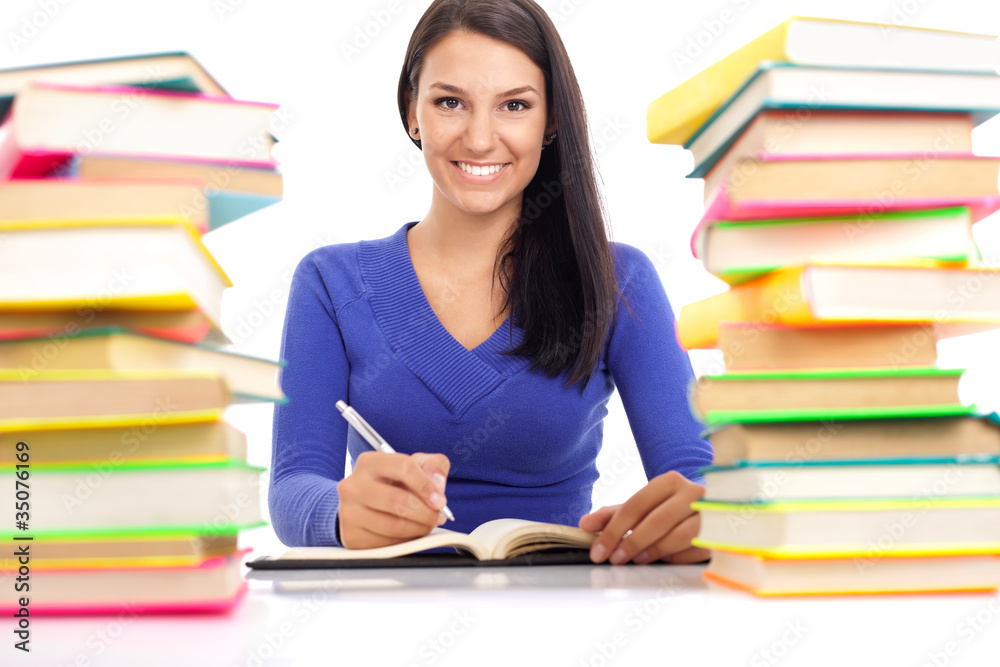 smiling student wit lot of books smiling student wit lot of books