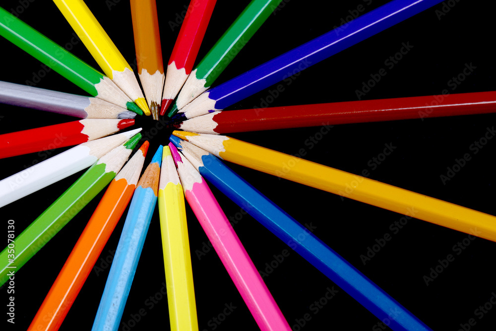 Assortment of coloured pencils with shadow on white/back backgro Assortment of coloured pencils with shadow on white/back backgro