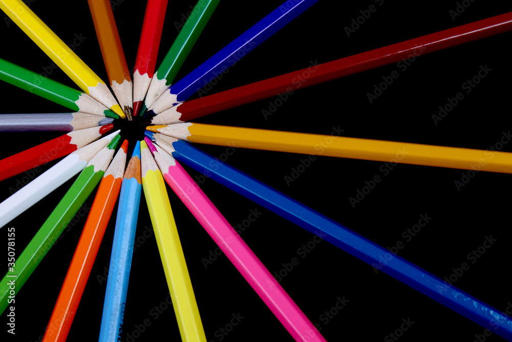 Assortment of coloured pencils with shadow on white/back backgro Assortment of coloured pencils with shadow on white/back backgro