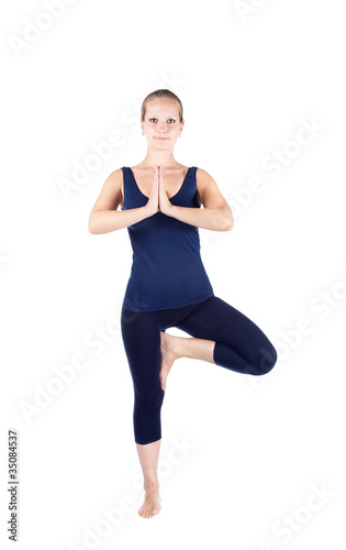 Yoga vrikshasana tree pose photo