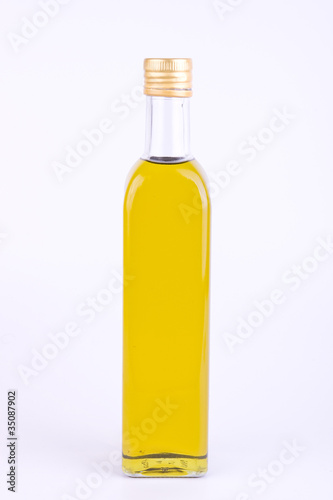 Square glass bottle of olive oil isolated