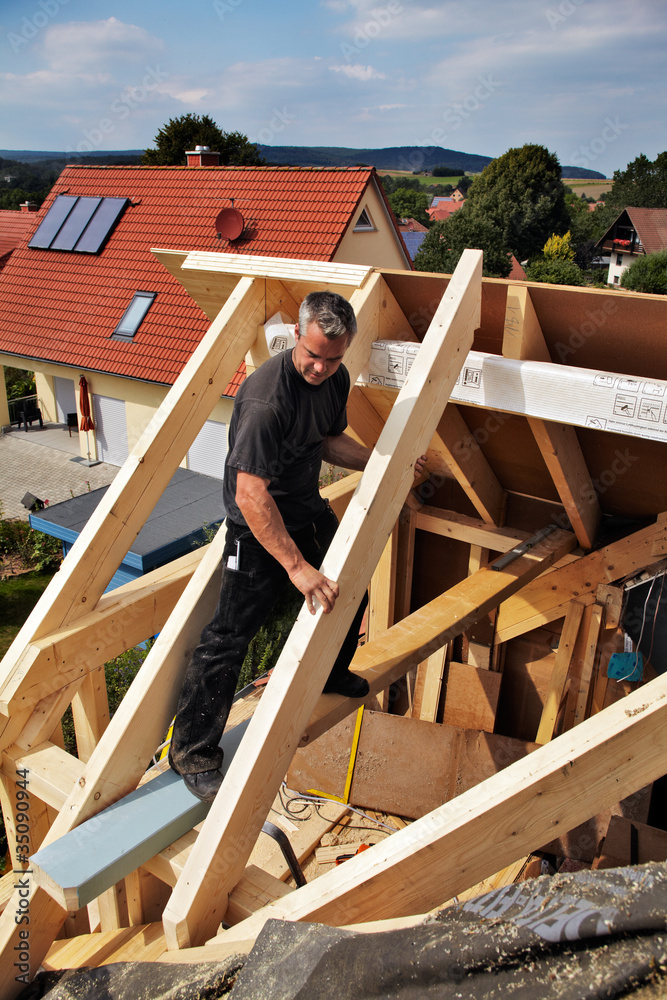 carpenters constructing a dormer carpenters constructing a dormer