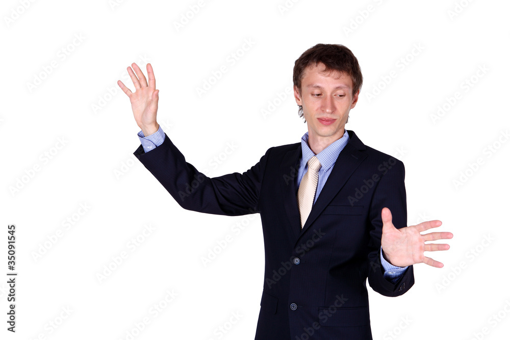 Business man in studio like touching a wall Business man in studio like touching a wall