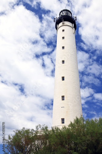 Biarritz lighthouse against a cloudy blue sky