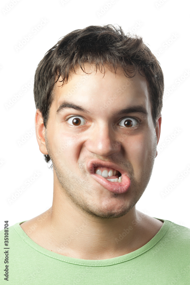 portrait of young grimacing man isolated on white background