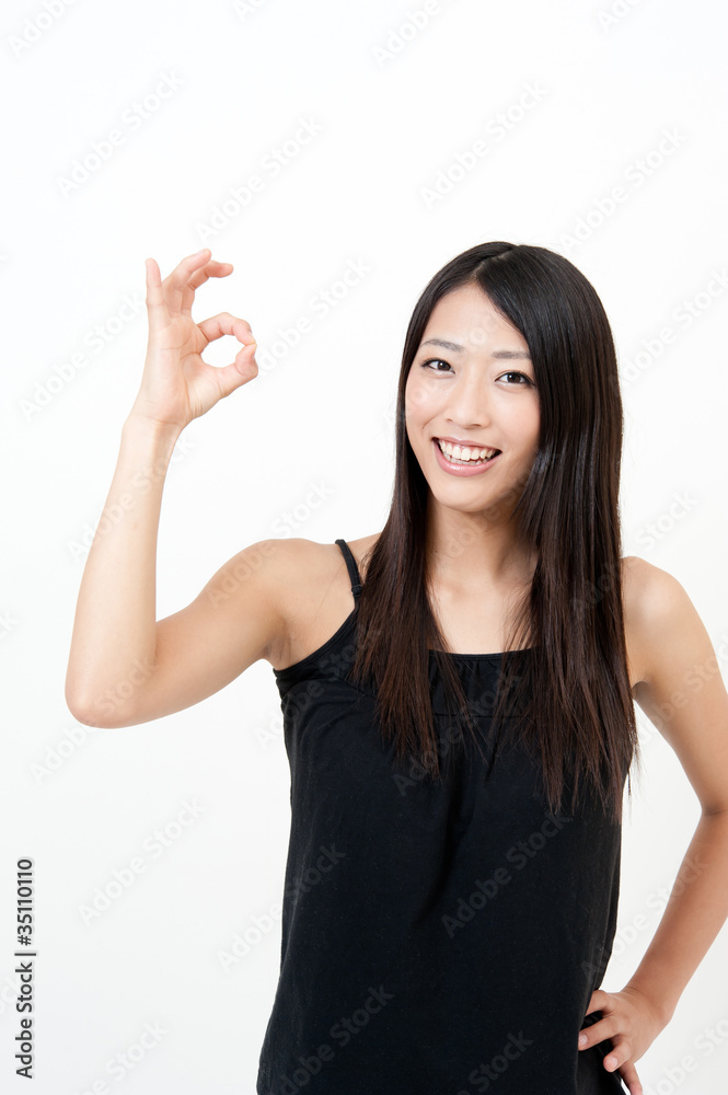 a portrait of attractive asian woman showing okay a portrait of attractive asian woman showing okay