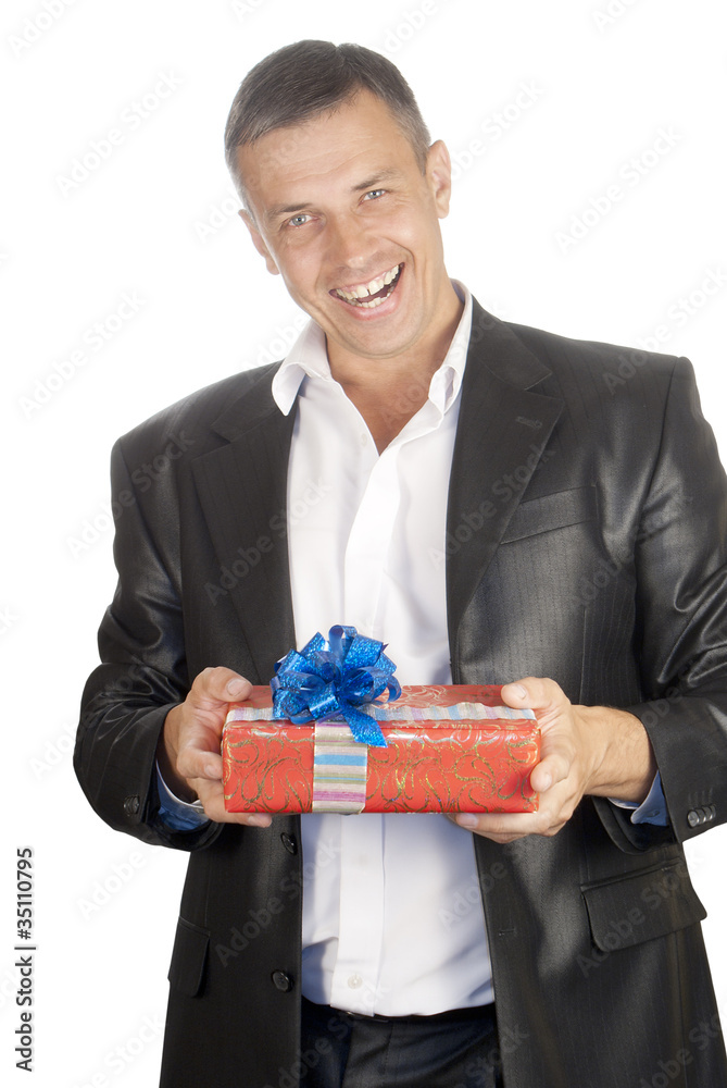 The happy smiling man with a celebratory gift The happy smiling man with a celebratory gift