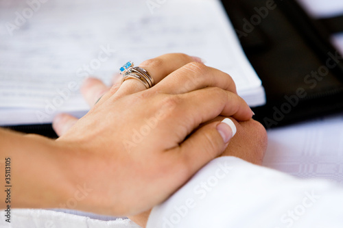 A close up of a bride s hand on the the groom s
