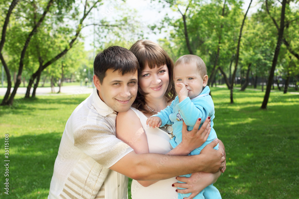 Young family together in the park Young family together in the park