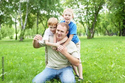 Portrait of father with two sons outdoor