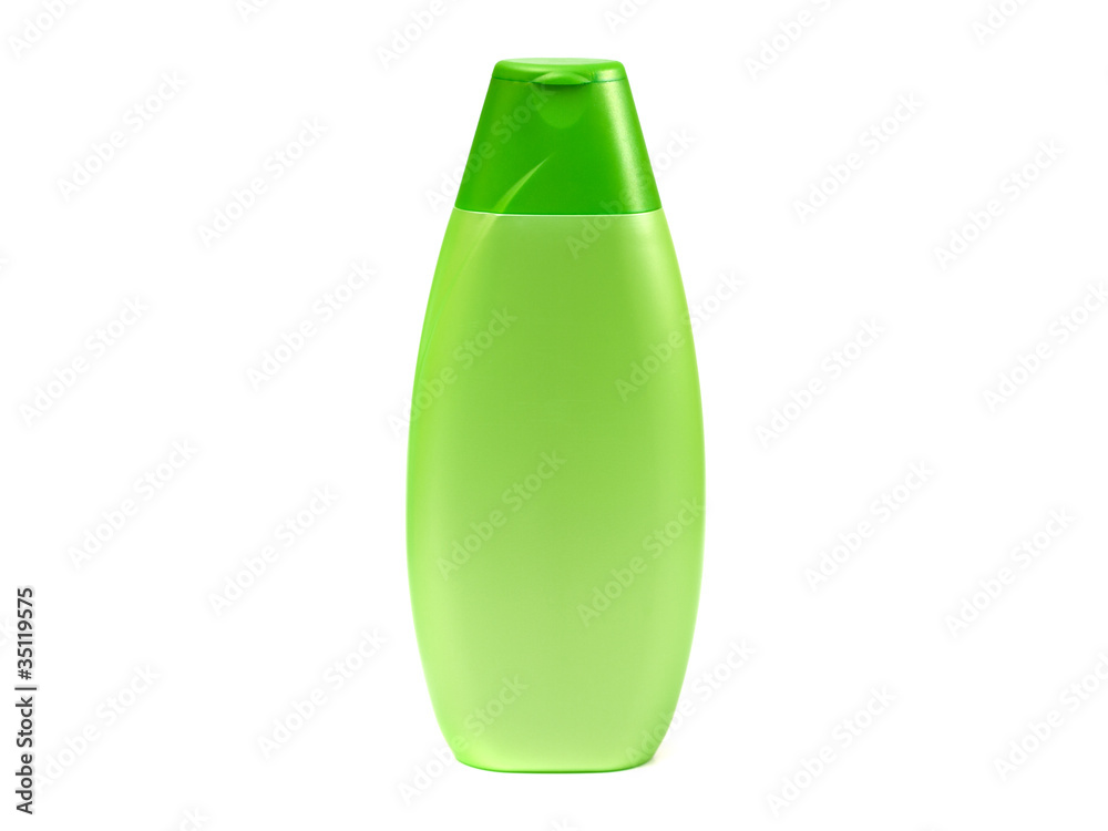 Green plastic tube with shampoo isolated
