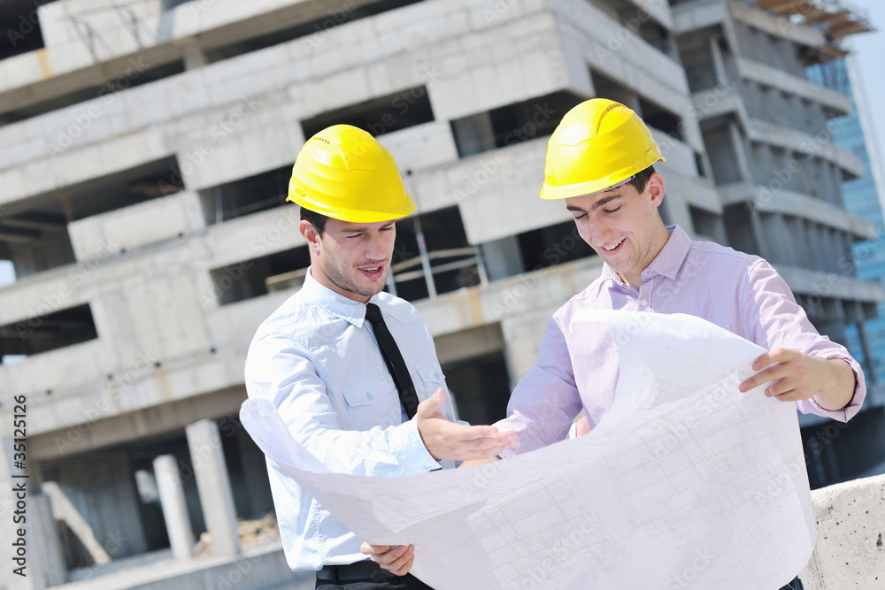 Team of architects on construciton site Team of architects on construciton site