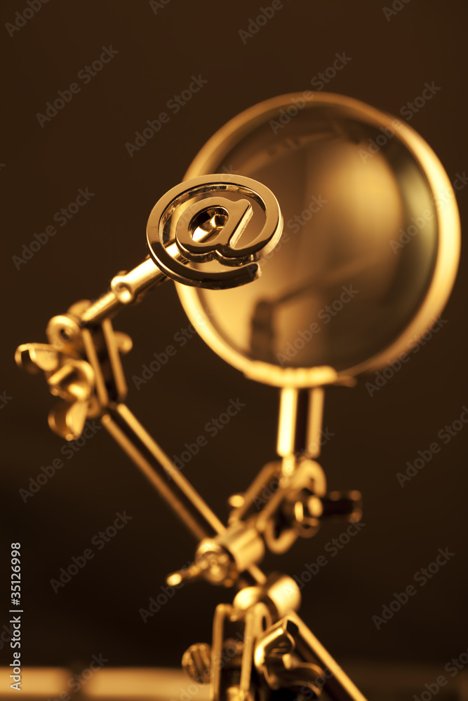 magnifying glass & gold internet symbol